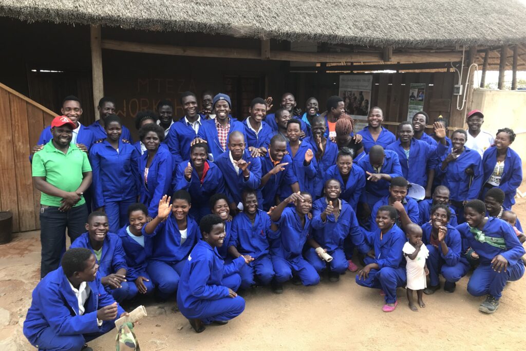A group of young people together in their community